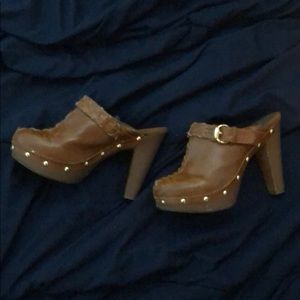 Slip on high heel clogs with gold buckle
